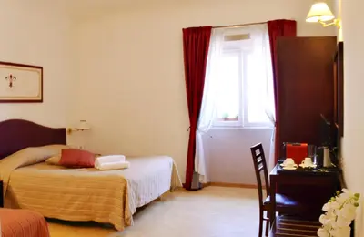 Letto o letti in una camera di Hotel Cardinal of Florence - recommended for ages 25 to 55