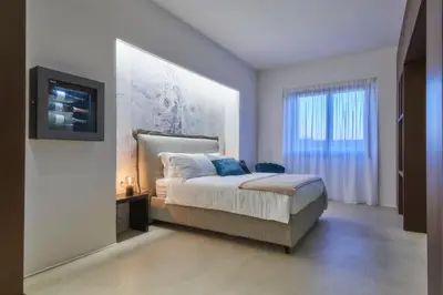 Letto o letti in una camera di Five stars Florence luxury apartments with Jacuzzi
