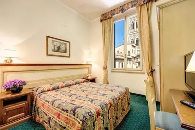 Letto o letti in una camera di Hotel De Lanzi