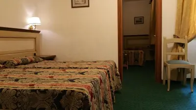 Letto o letti in una camera di Hotel De Lanzi