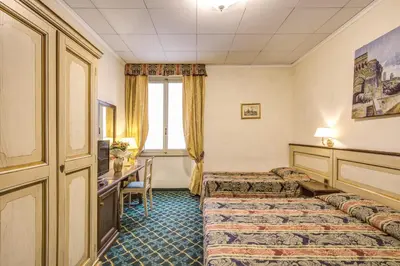 Letto o letti in una camera di Hotel De Lanzi