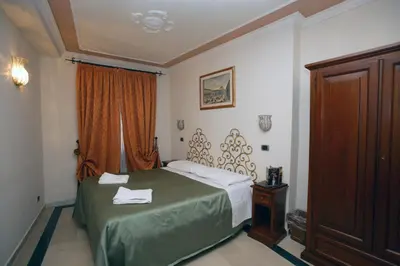 Letto o letti in una camera di Domus Florentiae Hotel