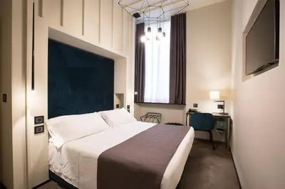 Letto o letti in una camera di Hotel Silla