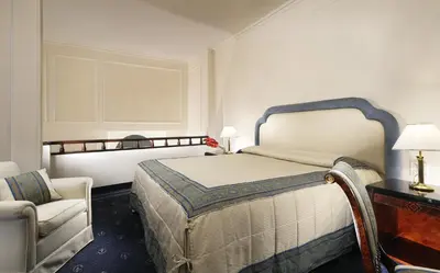 Letto o letti in una camera di Hotel De La Ville