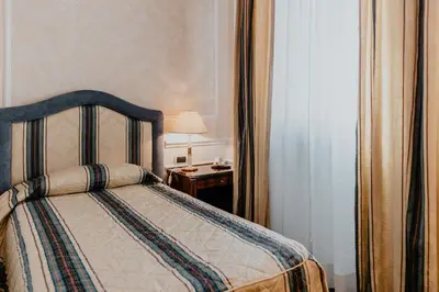 Letto o letti in una camera di Hotel De La Ville