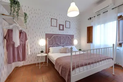 Letto o letti in una camera di Maddalena Apartment by Mamo Florence