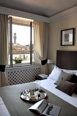 Letto o letti in una camera di Tornabuoni Suites Collection Residenza D'Epoca