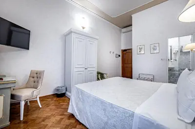 Letto o letti in una camera di Hotel Alessandra