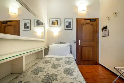 Letto o letti in una camera di Hotel Alessandra