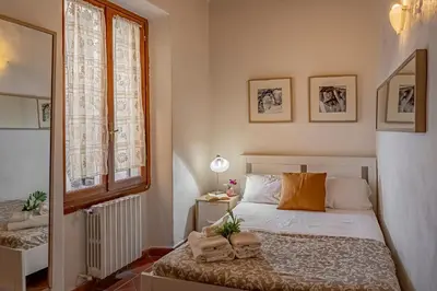 Letto o letti in una camera di Dante's Relais