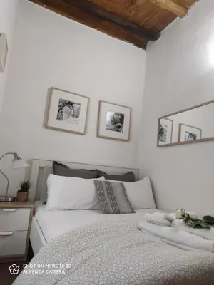 Letto o letti in una camera di Dante's Relais