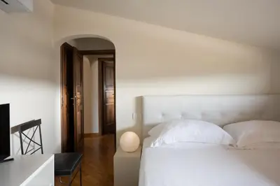 Letto o letti in una camera di Relais Piazza Signoria