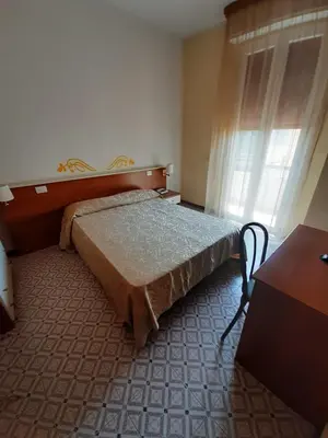 Letto o letti in una camera di Mio Hotel Firenze