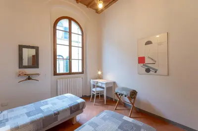Letto o letti in una camera di Sant'Agostino Apartments