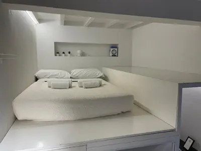 Letto o letti in una camera di Lola Loft