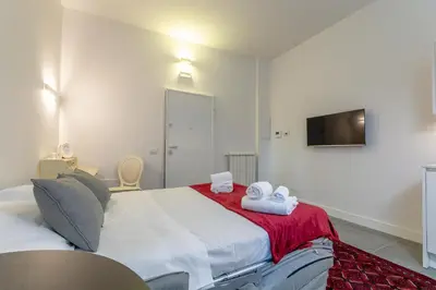 Letto o letti in una camera di Florence Michelangelo Suite Apartment