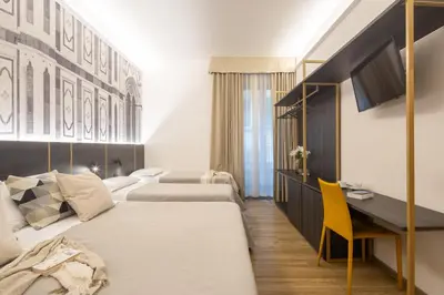 Letto o letti in una camera di Hotel Mia Cara & Spa