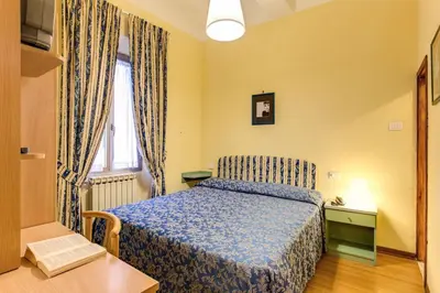 Letto o letti in una camera di Hotel Romagna