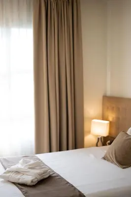 Letto o letti in una camera di Charme Hotel