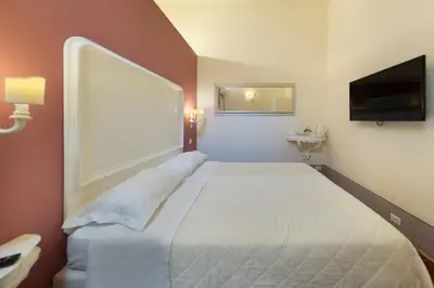 Letto o letti in una camera di B&B I Quattro Poeti