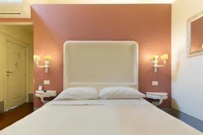 Letto o letti in una camera di B&B I Quattro Poeti