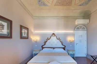 Letto o letti in una camera di B&B I Quattro Poeti