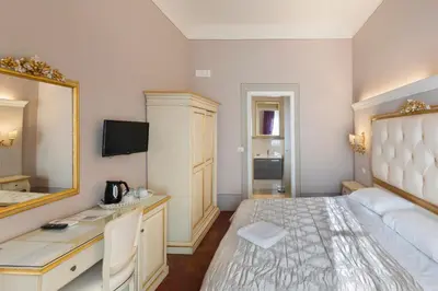 Letto o letti in una camera di B&B I Quattro Poeti
