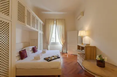 Letto o letti in una camera di Raso cozy penthouse near the Duomo