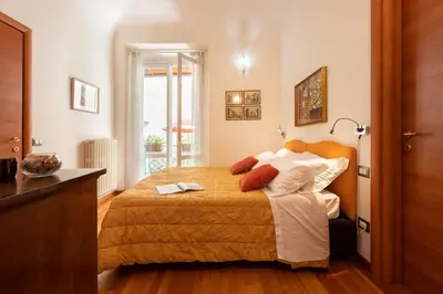 Letto o letti in una camera di Terrazza Foscolo - Flo Apartments