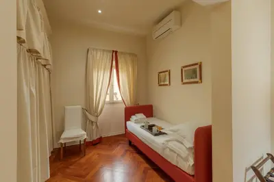 Letto o letti in una camera di Velluto elegant apartment near the Duomo