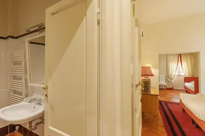 Letto o letti in una camera di Velluto elegant apartment near the Duomo