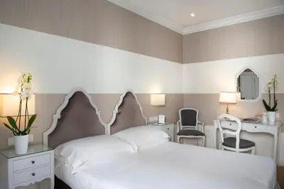 Letto o letti in una camera di Hotel Rapallo