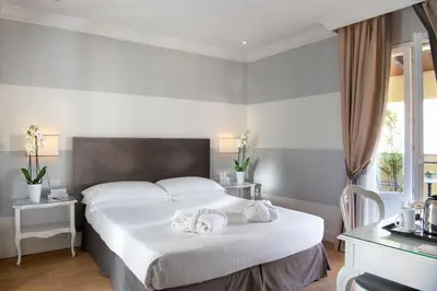 Letto o letti in una camera di Hotel Rapallo