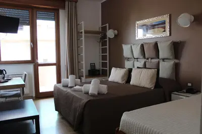 Letto o letti in una camera di Hotel Franchi