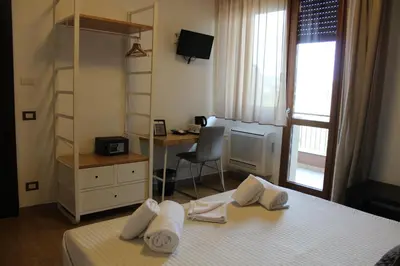 Letto o letti in una camera di Hotel Franchi