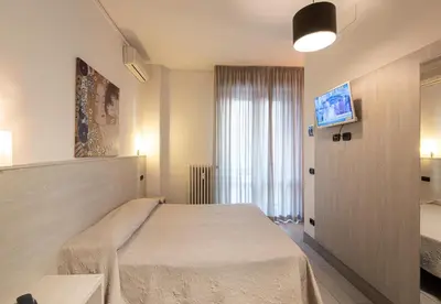 Letto o letti in una camera di Hotel Careggi