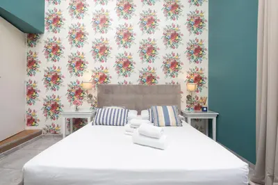 Letto o letti in una camera di Hotel Jolì