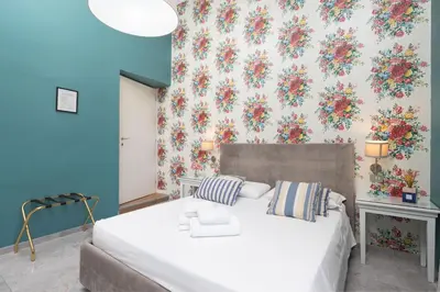 Letto o letti in una camera di Hotel Jolì