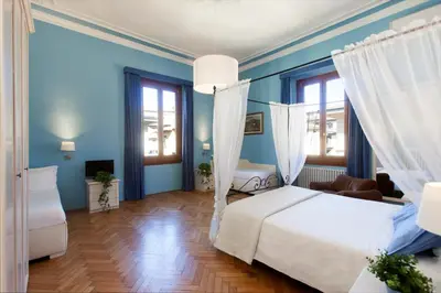 Letto o letti in una camera di Hotel Jolì