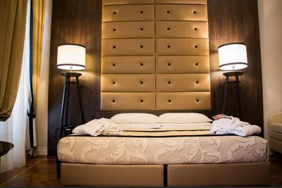 Letto o letti in una camera di Hotel Lombardia