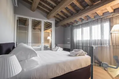 Letto o letti in una camera di Palazzo Castri 1874 Spa & Garden