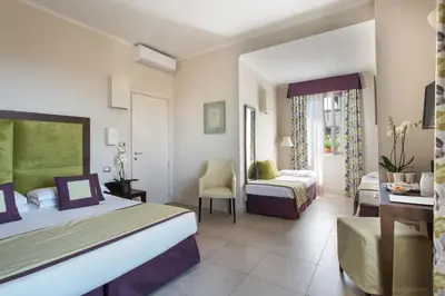 Letto o letti in una camera di Hotel Perseo