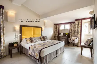 Letto o letti in una camera di Hotel Perseo
