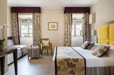 Letto o letti in una camera di Hotel Perseo