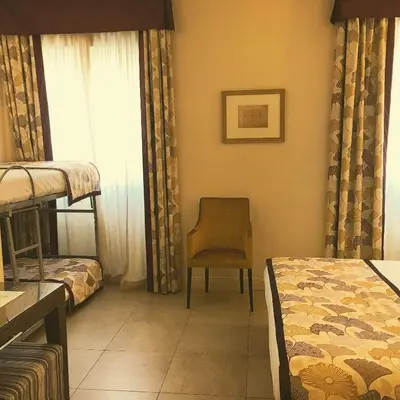 Letto o letti in una camera di Hotel Perseo