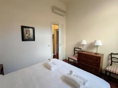 Letto o letti in una camera di Cashmere apartment a stone's throw from the Duomo