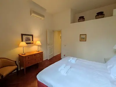Letto o letti in una camera di Cashmere apartment a stone's throw from the Duomo