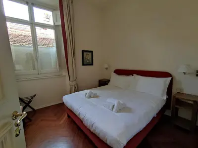 Letto o letti in una camera di Cashmere apartment a stone's throw from the Duomo