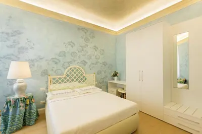 Letto o letti in una camera di Pendici di Fiesole - Appartamento Copperstone