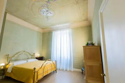 Letto o letti in una camera di Pendici di Fiesole - Appartamento Copperstone